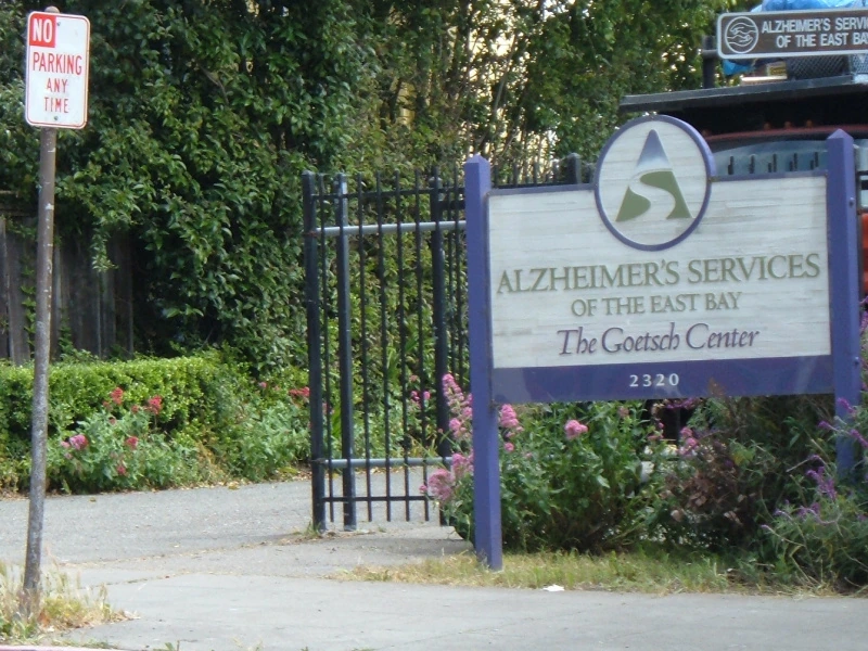 There is a No Parking sign outside the Alzheimer's Services of the East Bay.