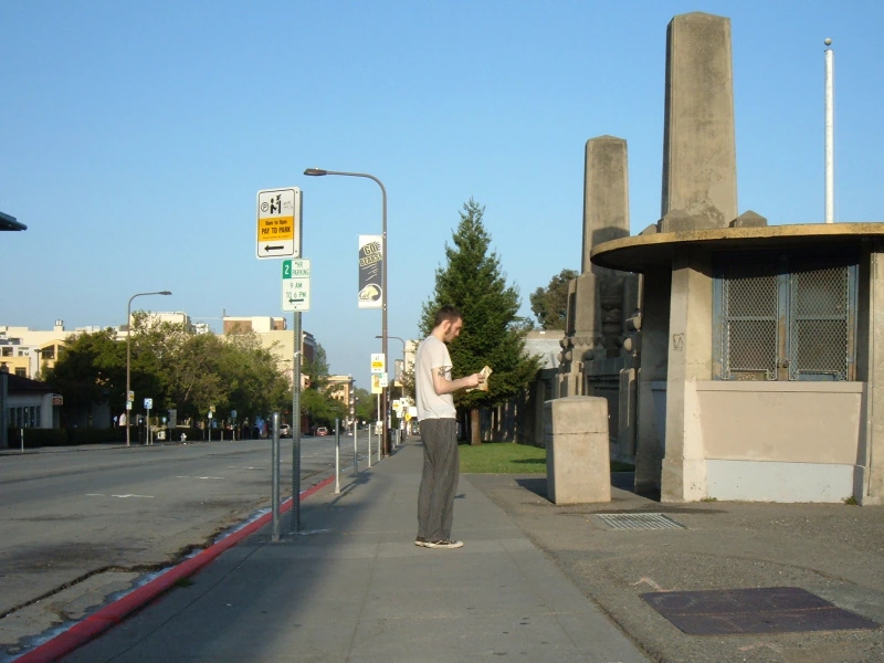 A long angle shot of a daylight street with nobody on it, except Josh.