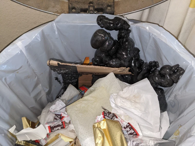 A strange, abyss-like monster growing out of the trash.