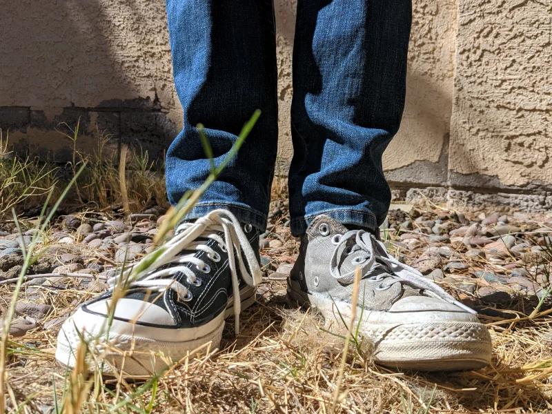 Two legs, two shoes, with the left one showing a lot of damage.