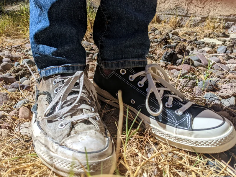 Two legs, two shoes, with the right one showing a lot of damage.