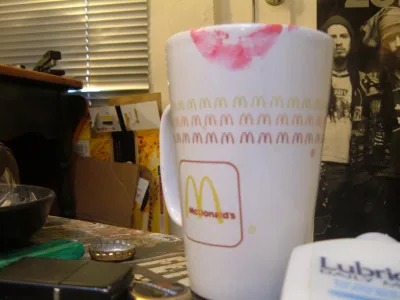 Lipstick on a McDonald's coffee mug.