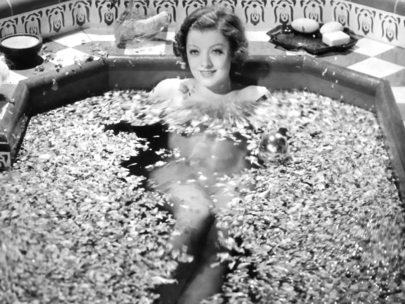 Myrna Loy floats in a bath of rose petals.