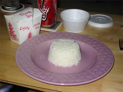 A block of rice maintains the shape of its container.