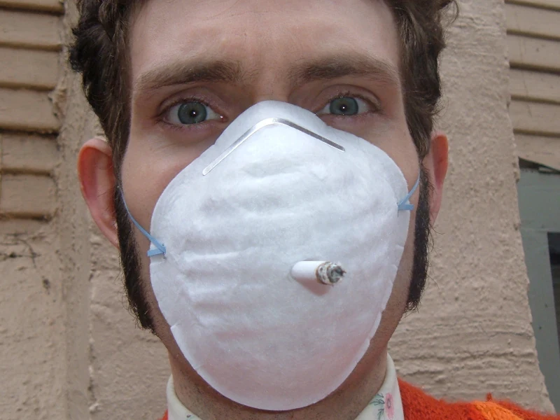 A face mask with a hole for a cigarette.